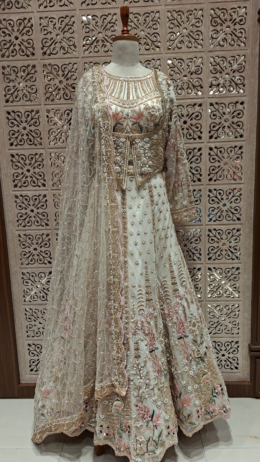 IVORY BRIDAL LEHENGA WITH PESTAL FLORAL ACCENTS