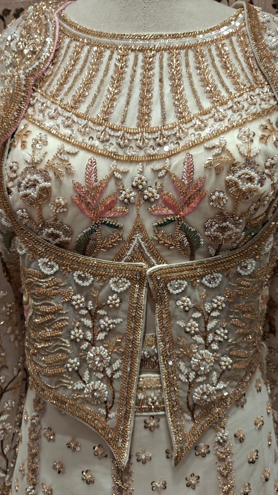 IVORY BRIDAL LEHENGA WITH PESTAL FLORAL ACCENTS