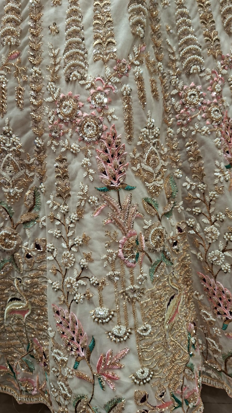 IVORY BRIDAL LEHENGA WITH PESTAL FLORAL ACCENTS