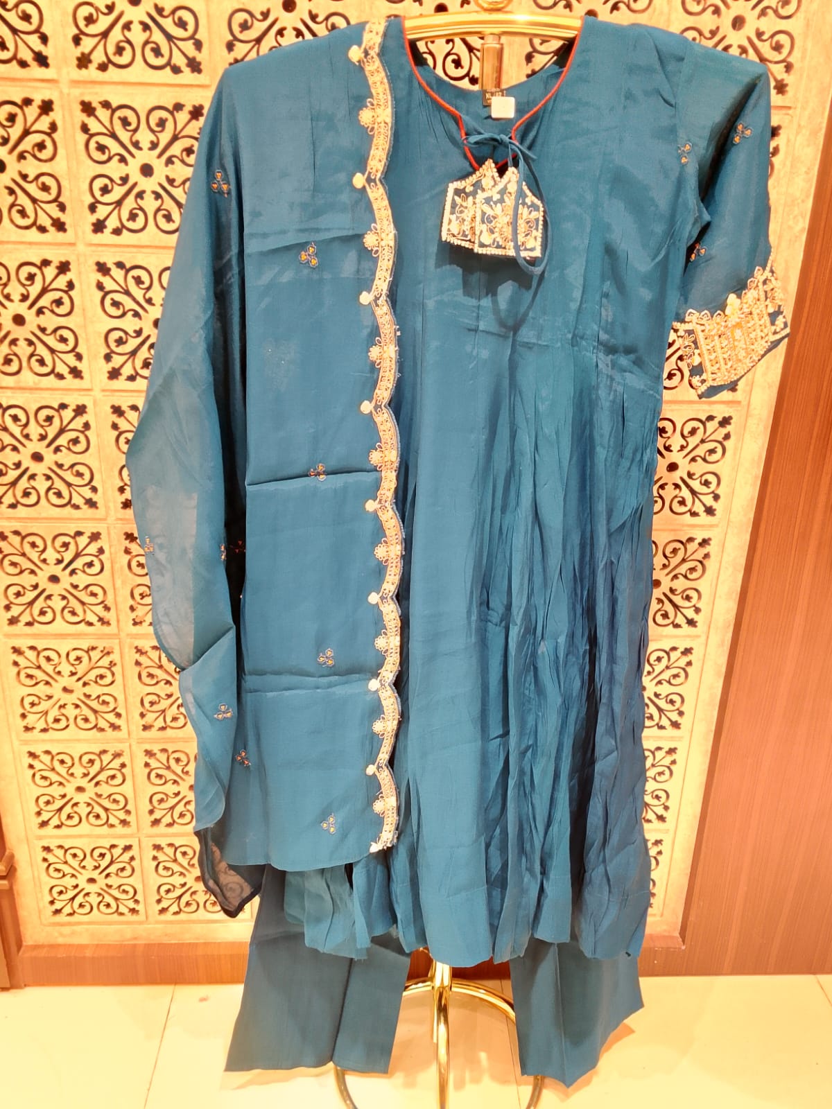 sophisticated peacock blue Anarkali suit set  luxurious Mul Chanderi fabric.