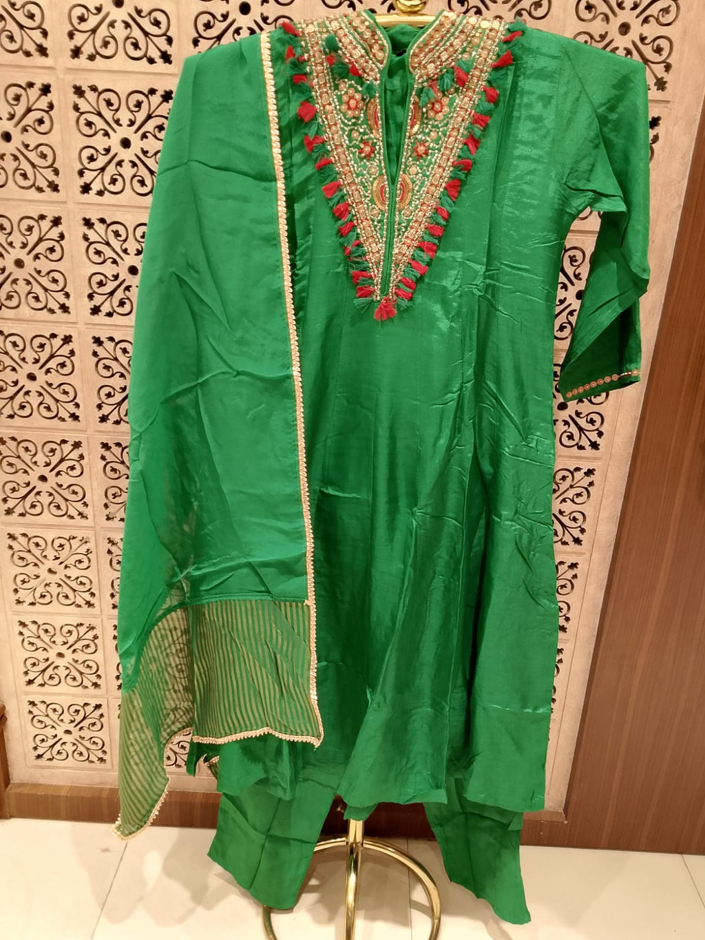 vibrant emerald green Anarkali suit set luxurious Satin silk-blend fabric.