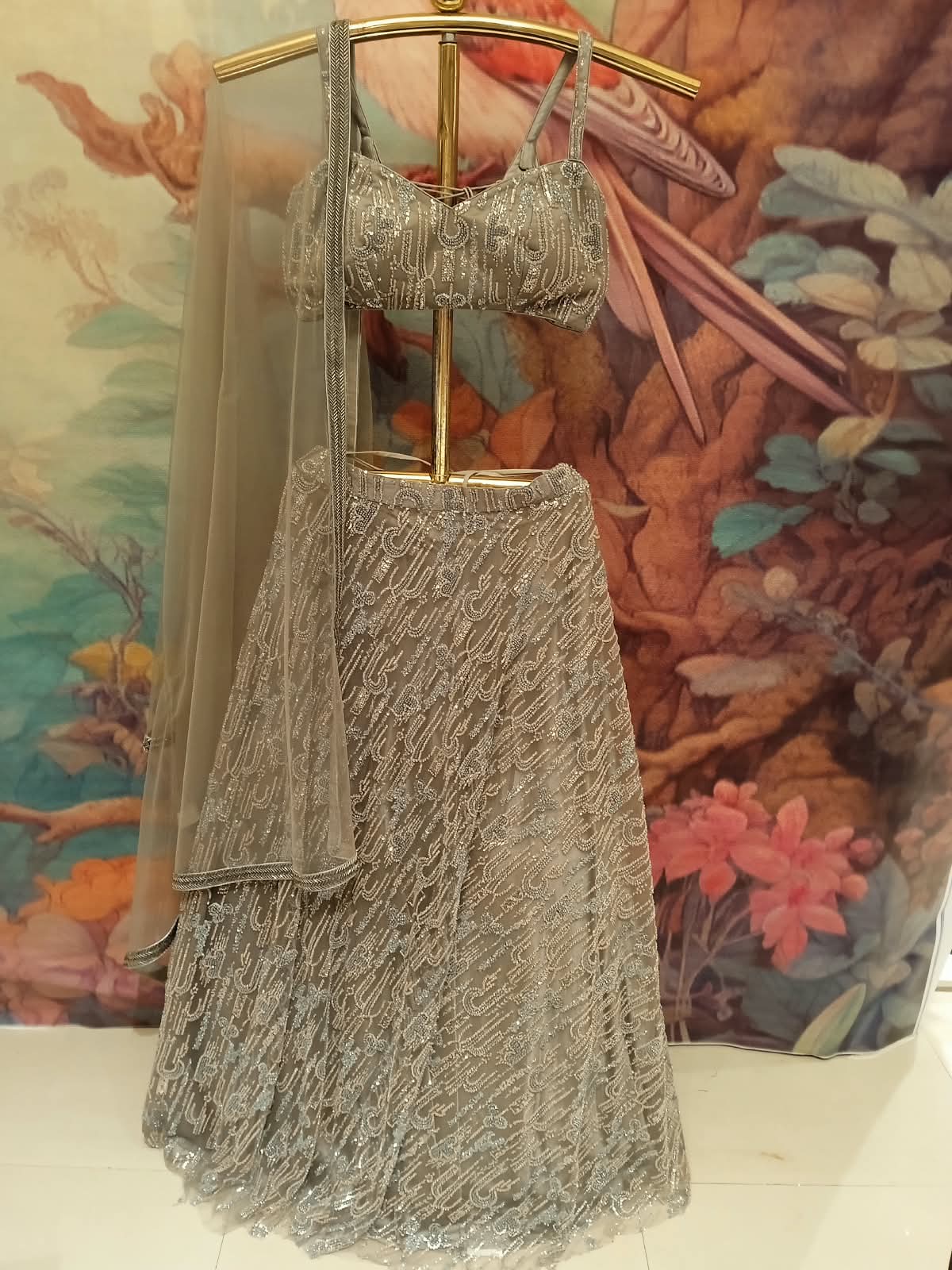 glamorous silver-grey metallic lehenga choli ensemble Premium net and shimmer fabrics,