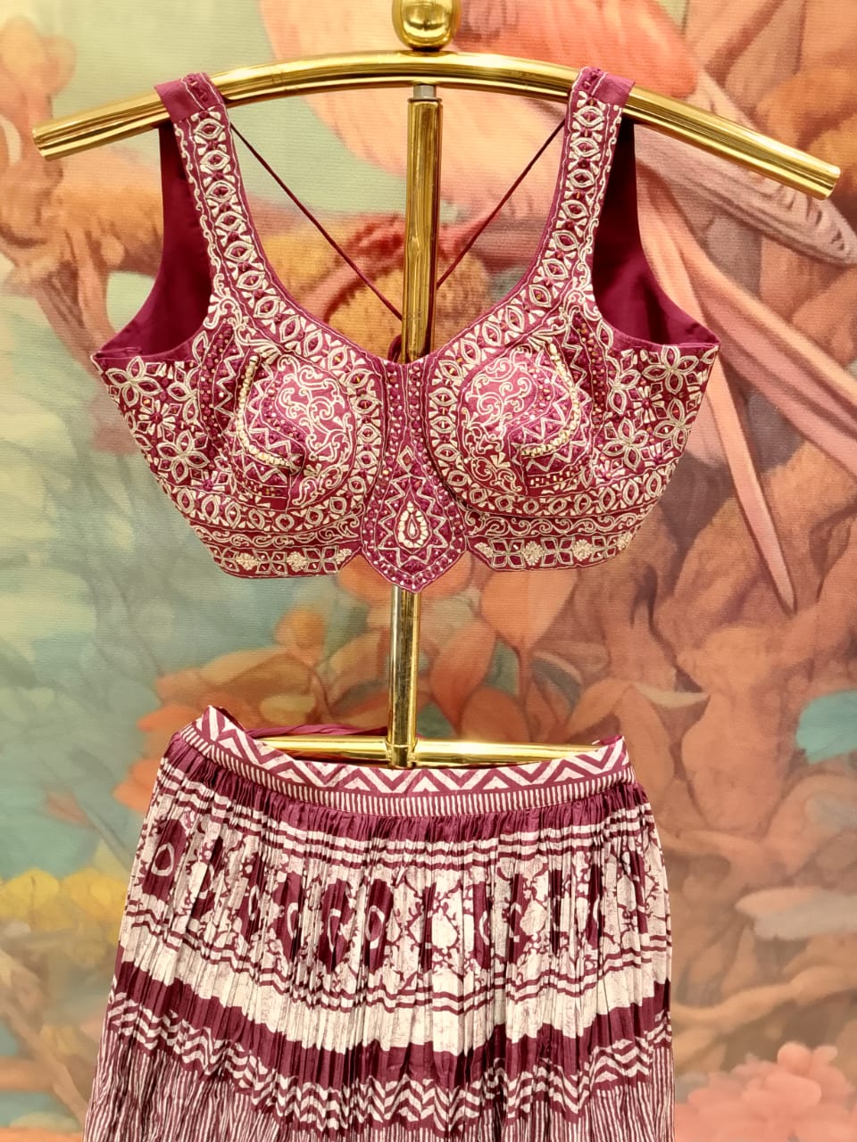 sophisticated wine-colored lehenga choli set premium Silk and crinkle-textured fabrics.