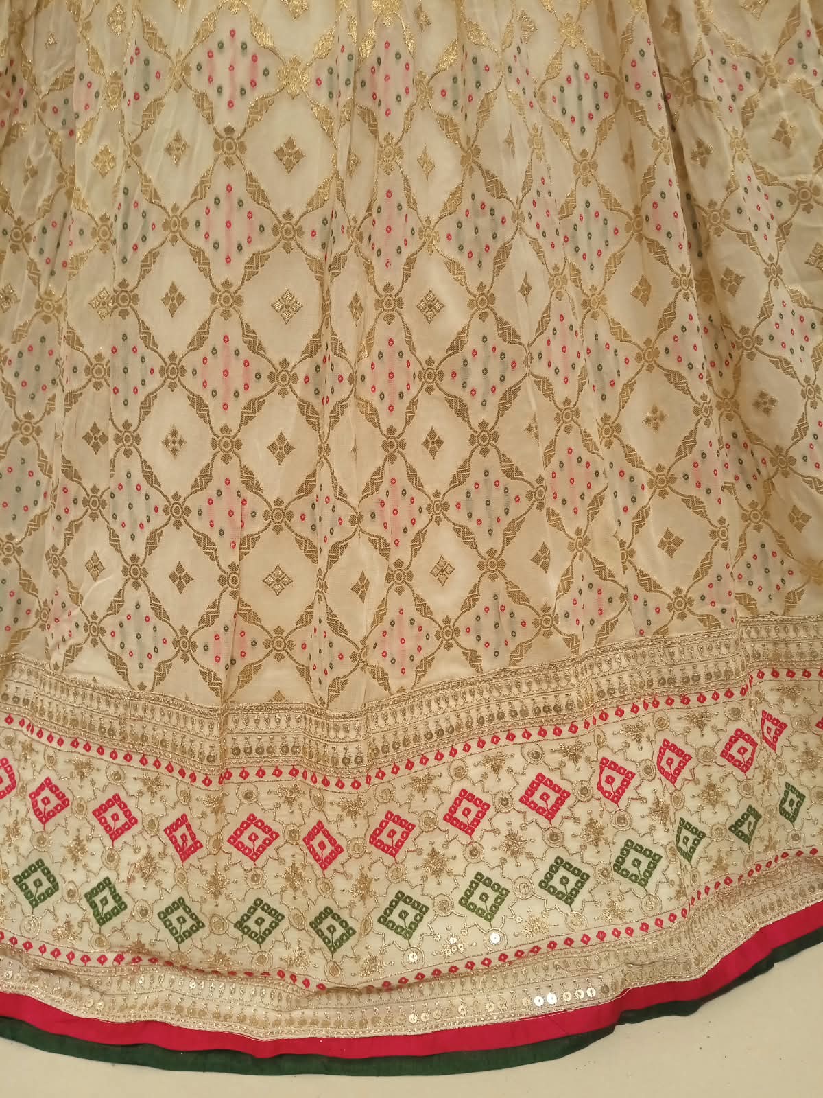 elegant ivory and gold Patola-inspired lehenga choli  premium lightweight georgette.