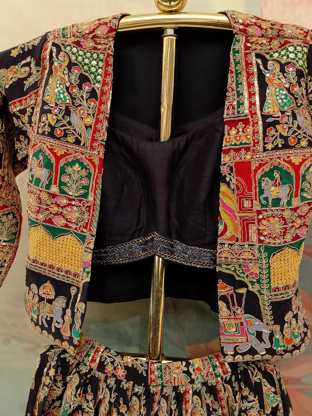 three-piece jacket Satin Silk lehenga set intricate traditional print and embroidery patterns.