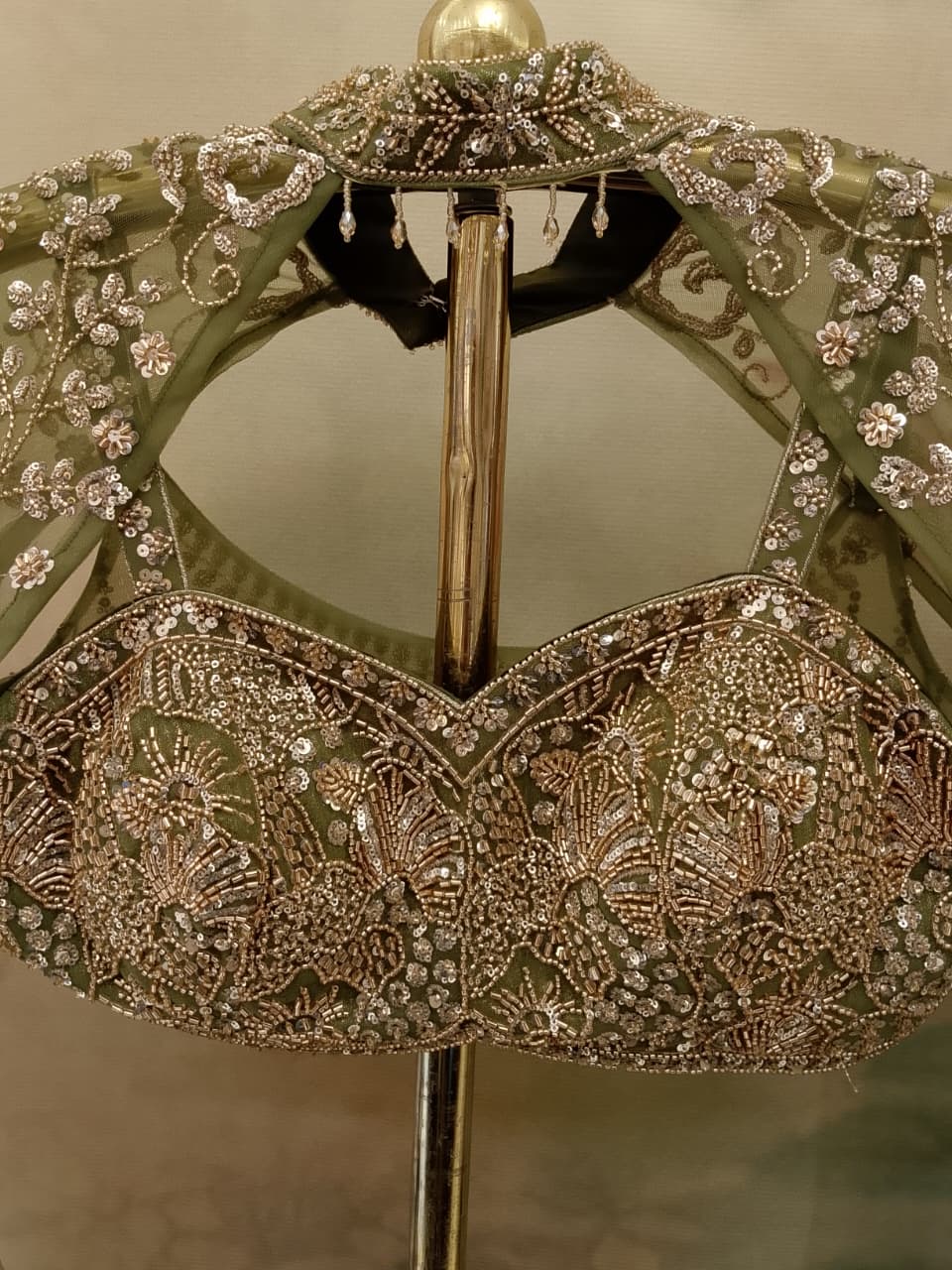 sage green lehenga choli shimmer georgette and sheer net fabrics.
