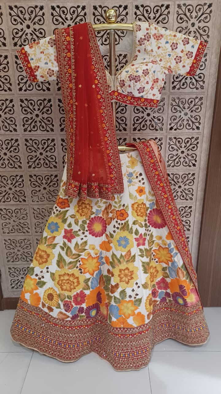 vibrant ivory and red floral lehenga choli off-white ivory base canvas  Mehendi ceremonies, bridal wear, sangeet functions, and high-end festive celebrations