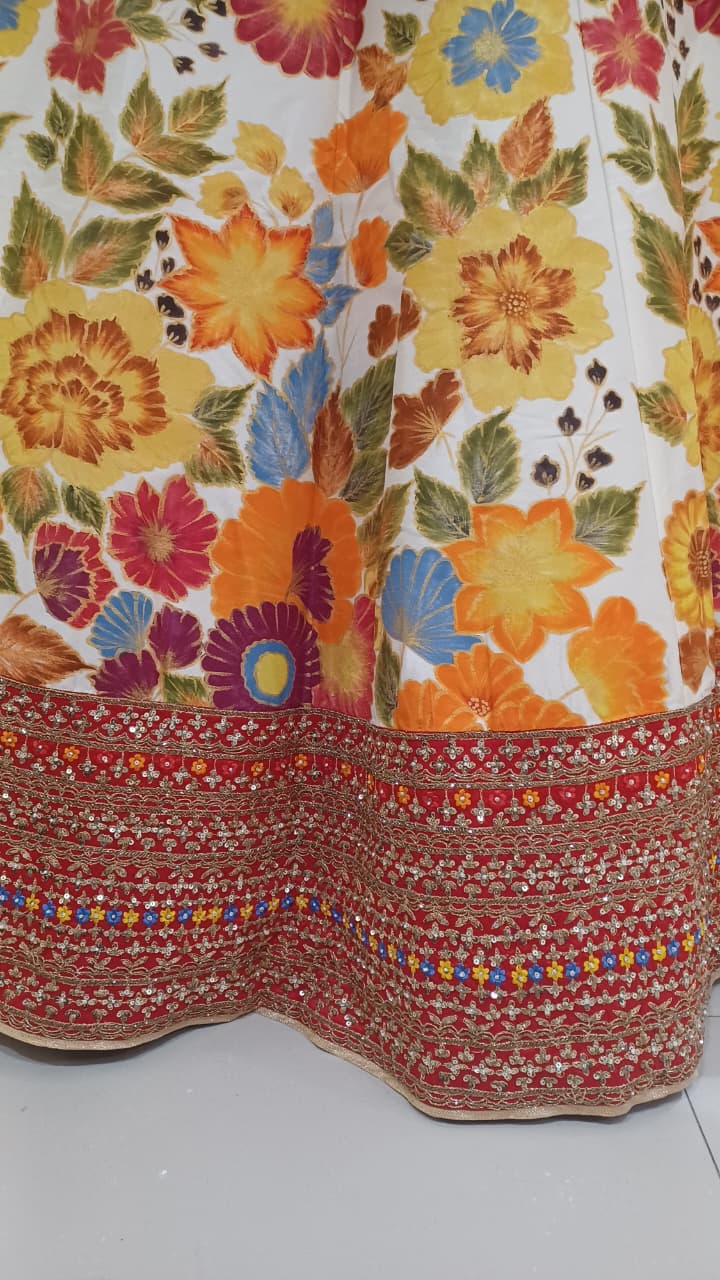 vibrant ivory and red floral lehenga choli off-white ivory base canvas  Mehendi ceremonies, bridal wear, sangeet functions, and high-end festive celebrations