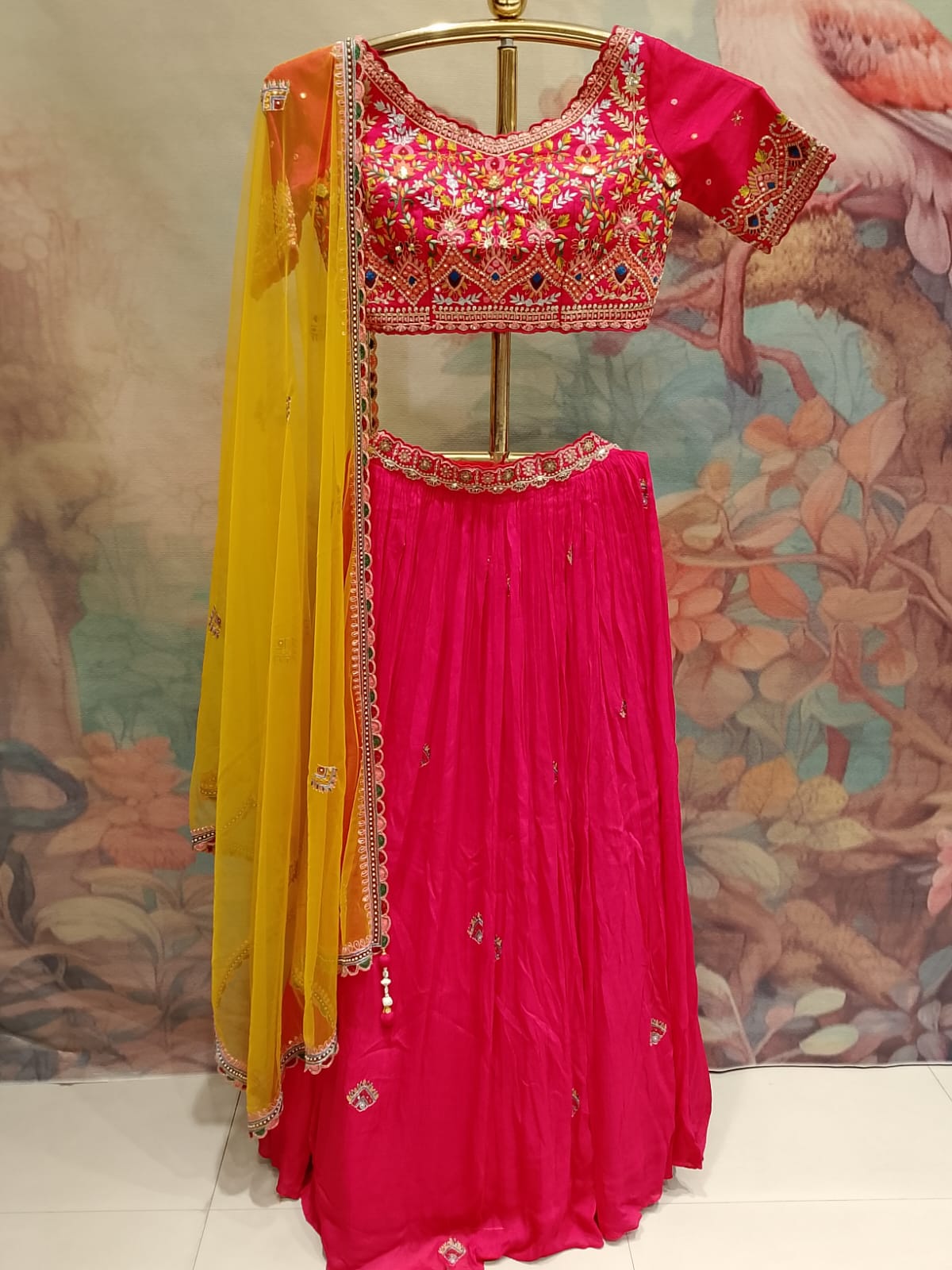 Rani Pink Hand-Embroidered Georgette Lehenga Choli with Bright Yellow Dupatta.