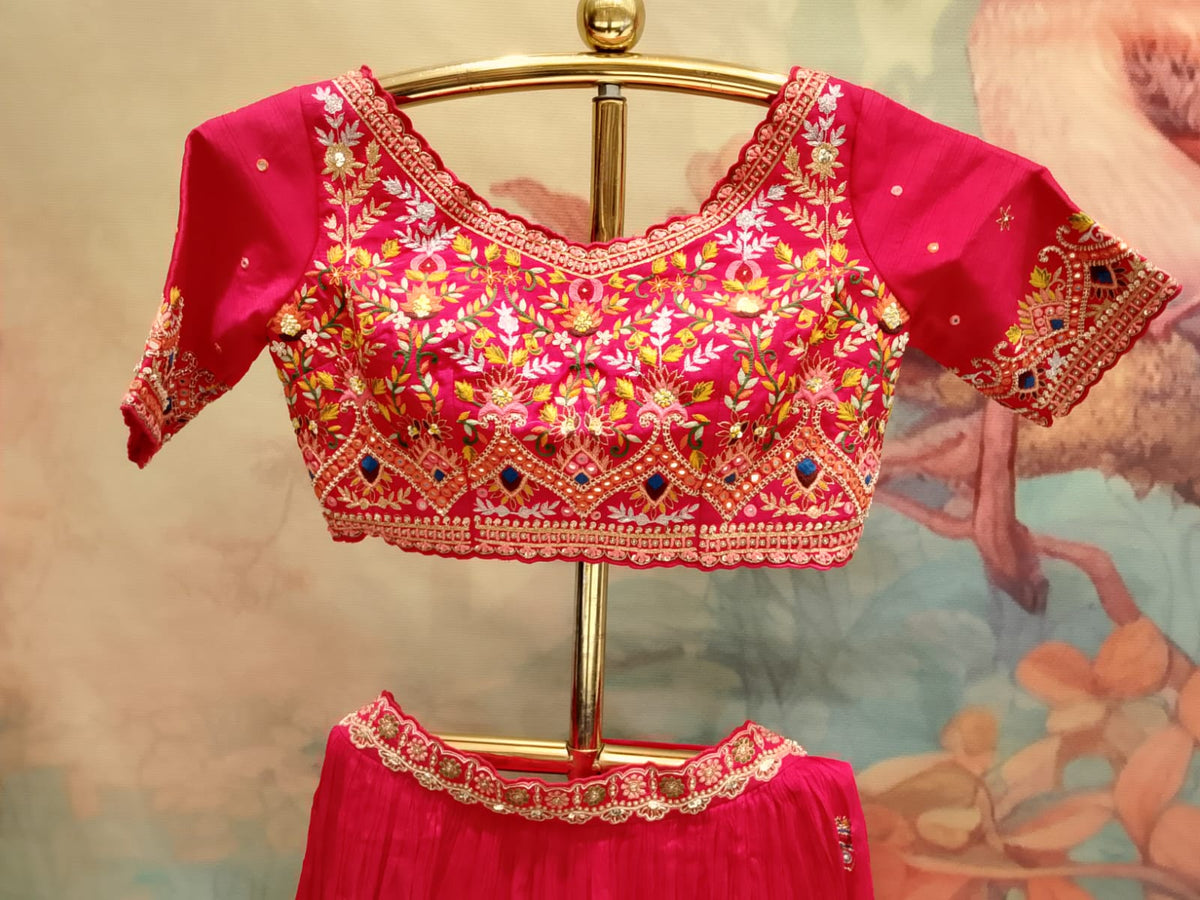 Rani Pink Hand-Embroidered Georgette Lehenga Choli with Bright Yellow Dupatta.