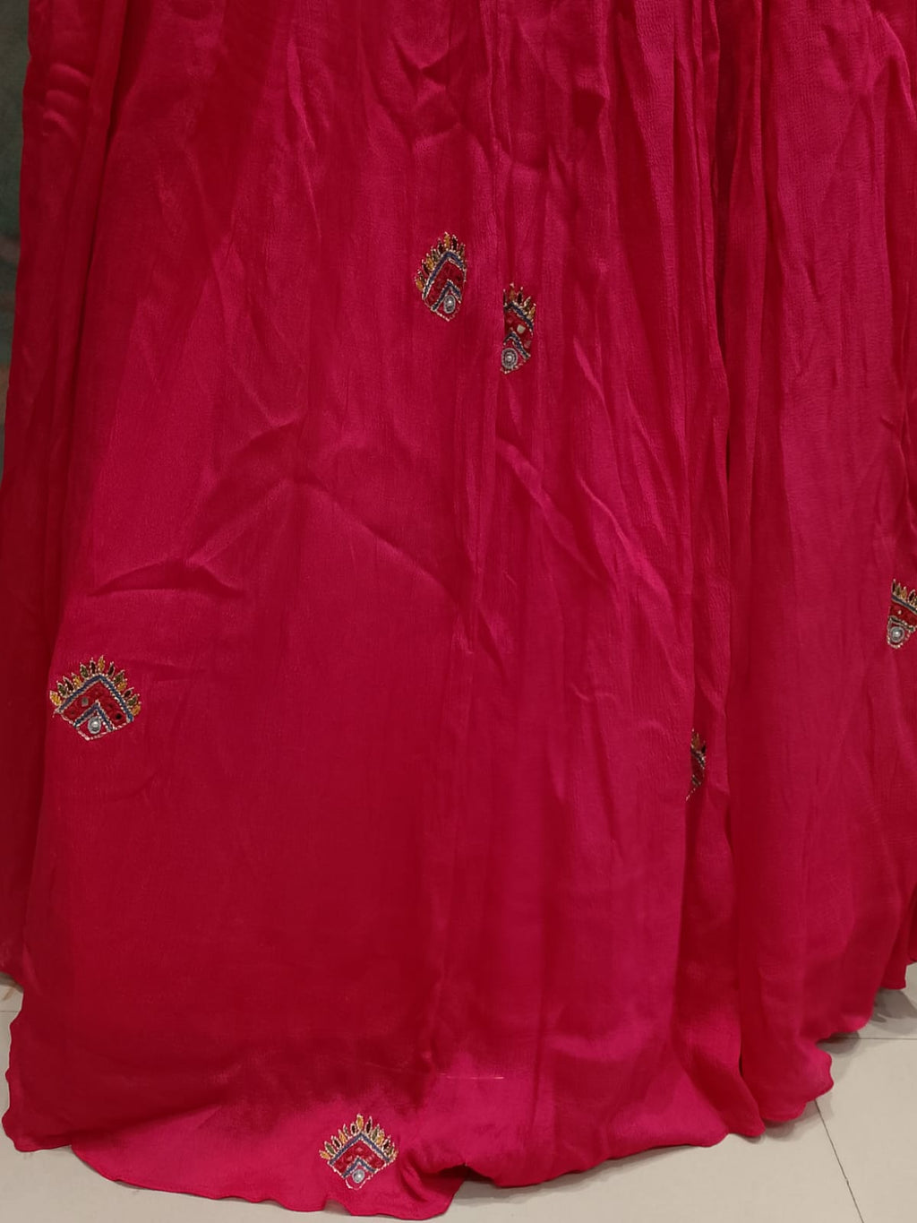Rani Pink Hand-Embroidered Georgette Lehenga Choli with Bright Yellow Dupatta.