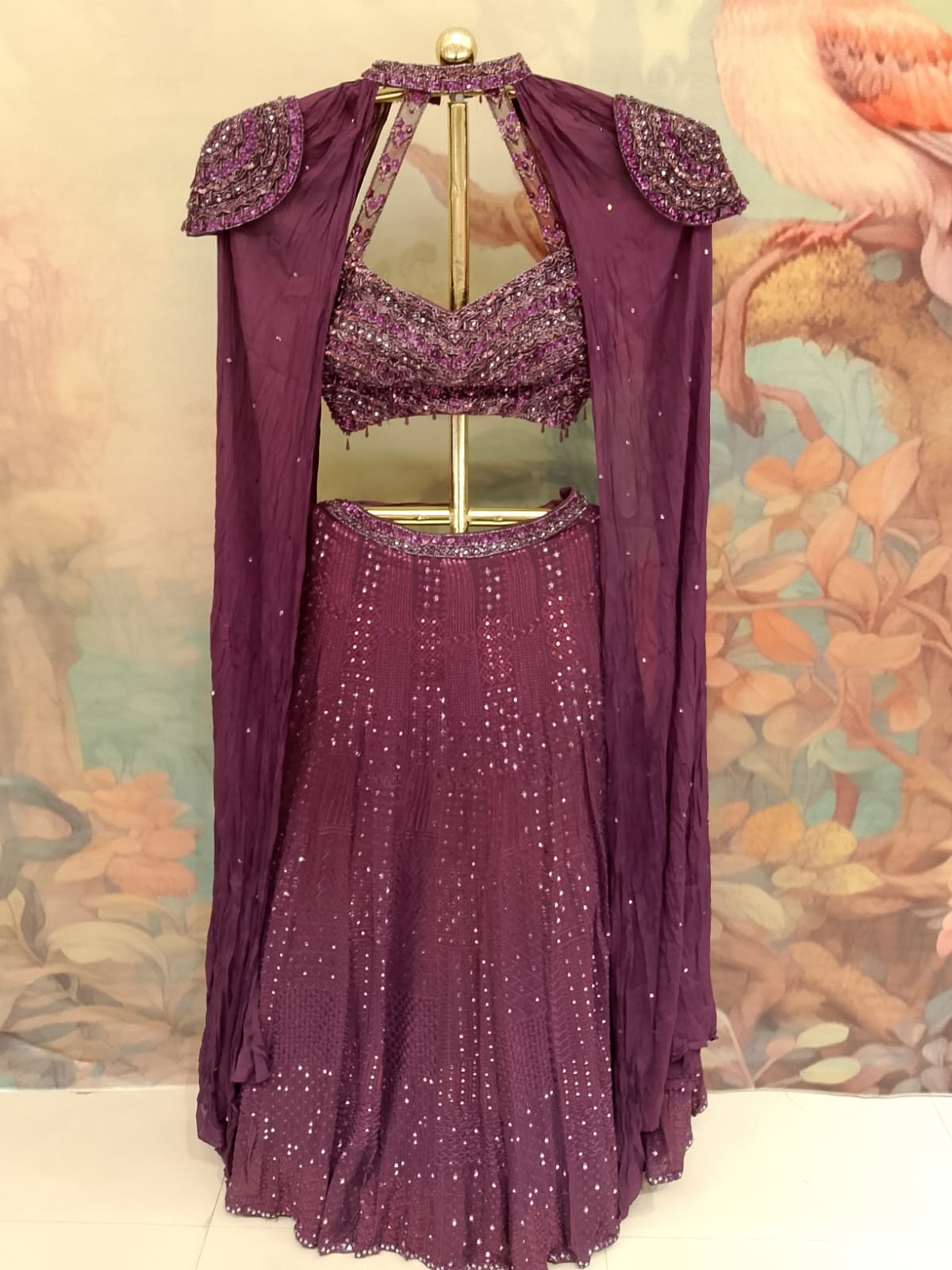 Wine Georgette Cape-Style Lehenga Choli with Hand-Embroidered Blouse.