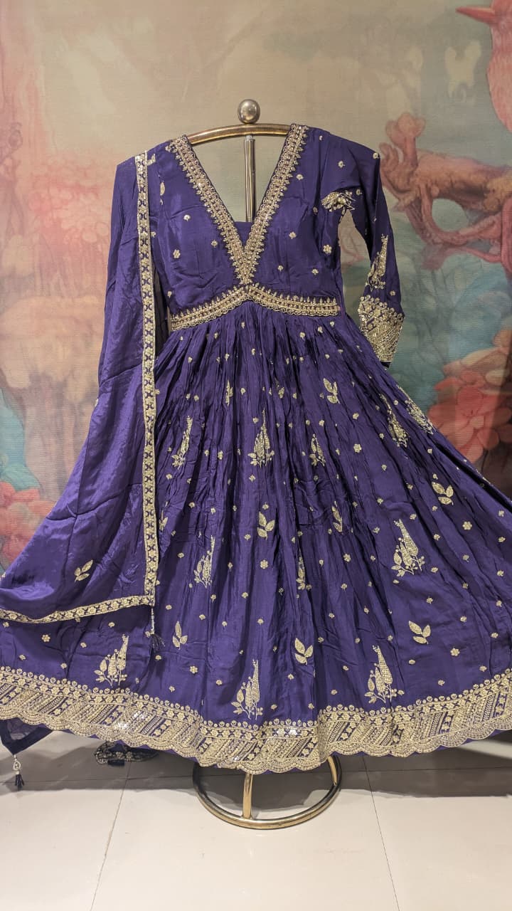 deep purple, floor-length traditional Georgette gown With embroidered dupatta.