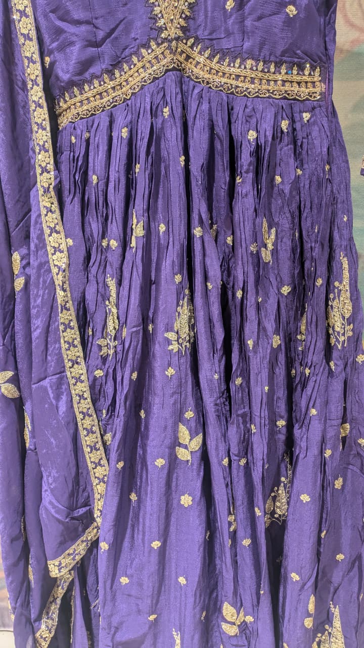 deep purple, floor-length traditional Georgette gown With embroidered dupatta.