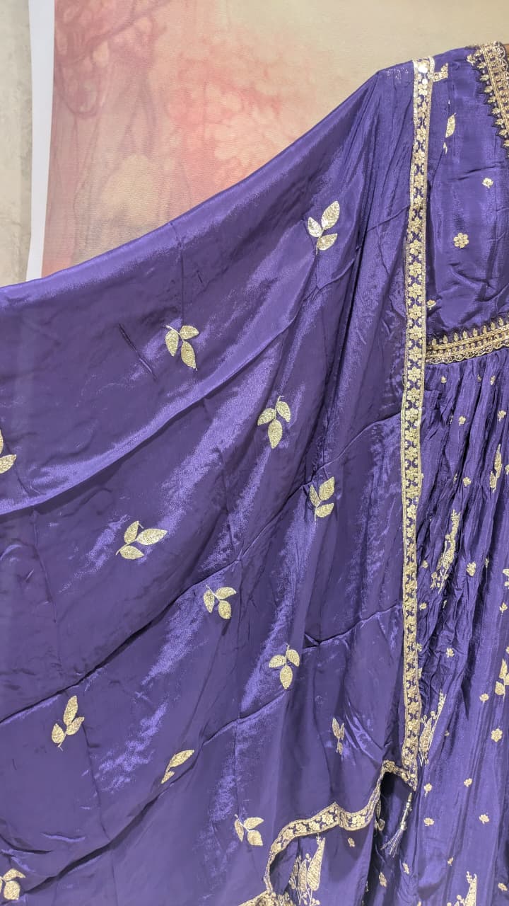 deep purple, floor-length traditional Georgette gown With embroidered dupatta.