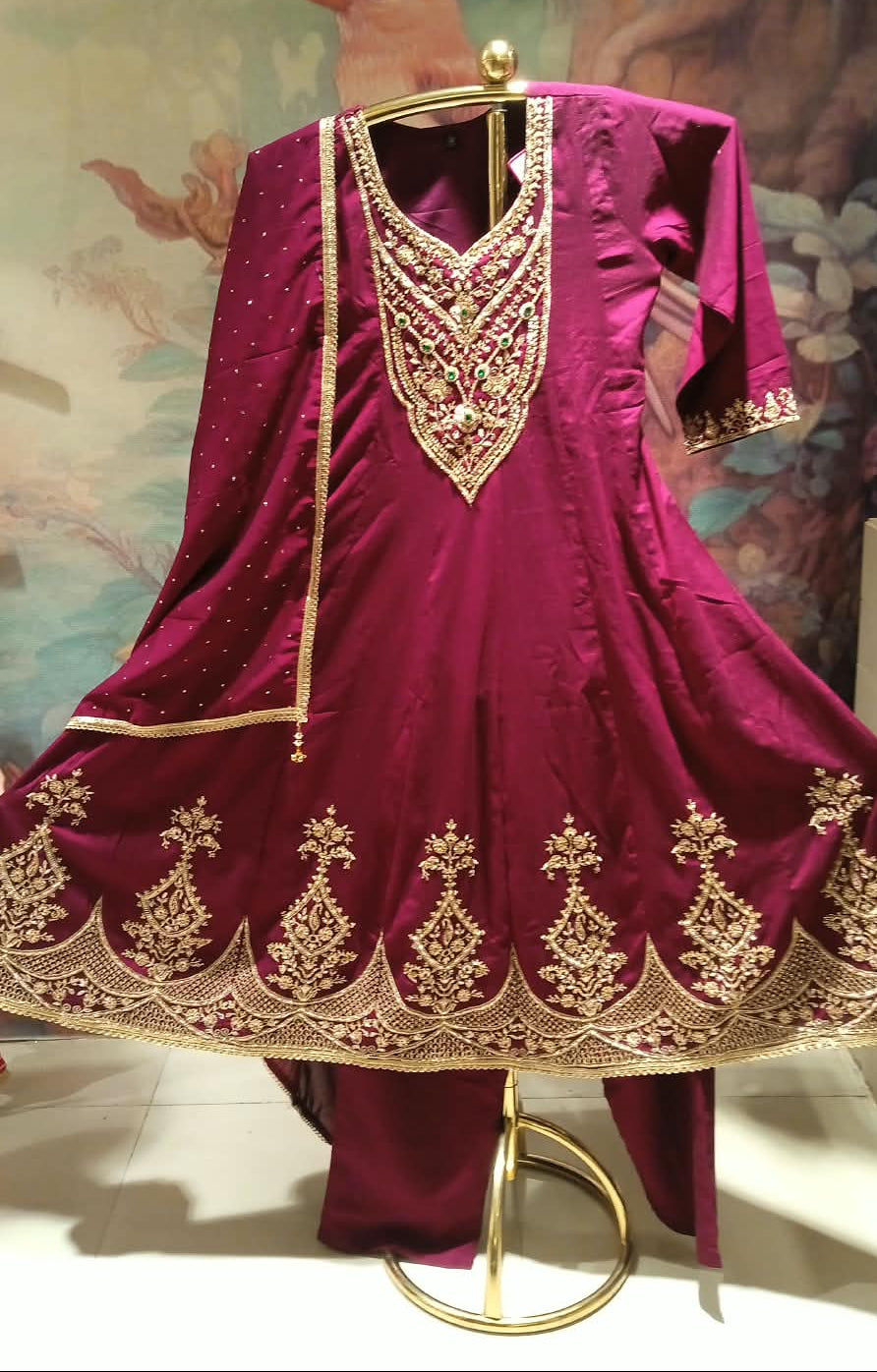 wine-colored, three-piece traditional ethnic Satin Silk suit set Anarkali kurta, dupatta with gold borders.