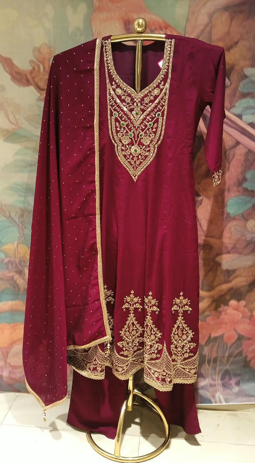 wine-colored, three-piece traditional ethnic Satin Silk suit set Anarkali kurta, dupatta with gold borders.