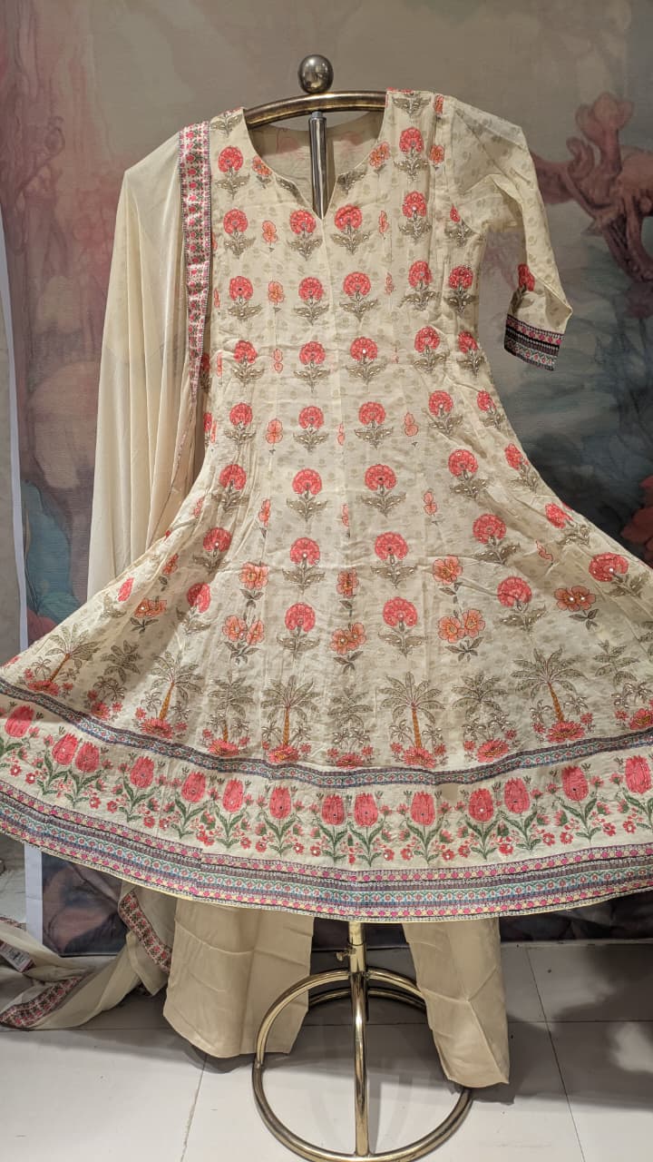cream-colored, three-piece traditional ethnic ensemble Mul Chanderi Anarkali-style kurta straight-cut trousers, solid dupatta.