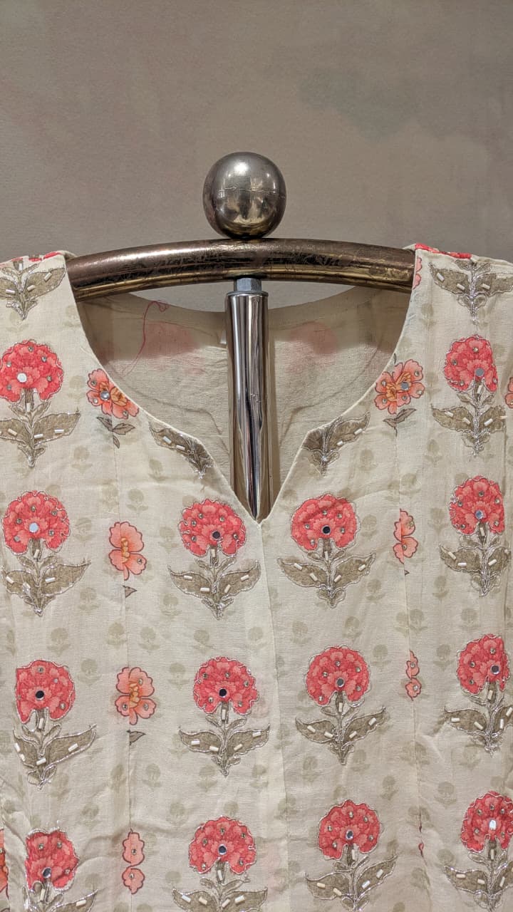 cream-colored, three-piece traditional ethnic ensemble Mul Chanderi Anarkali-style kurta straight-cut trousers, solid dupatta.