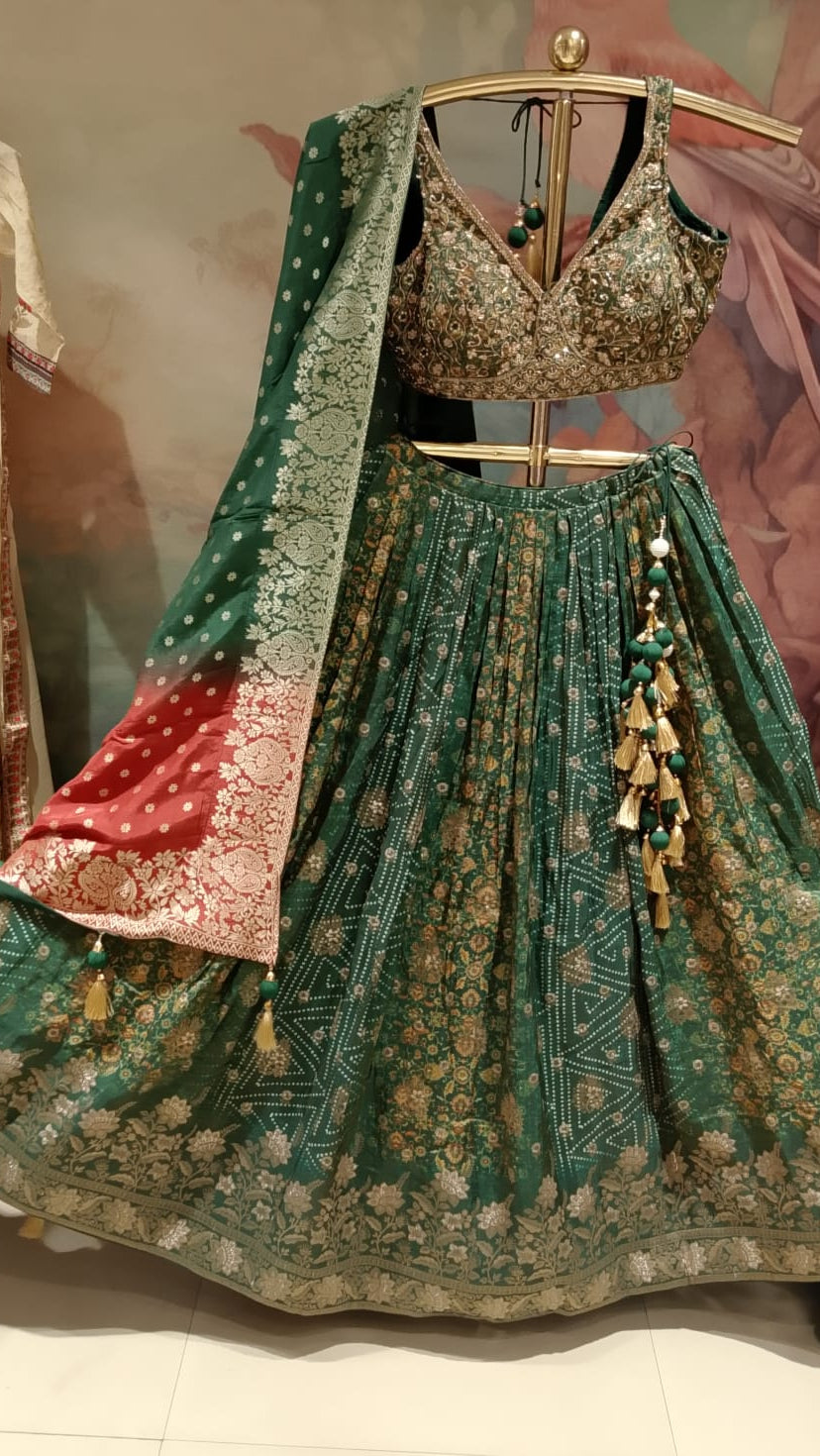 rich emerald-green and rust-red traditional Banarasi Silk lehenga choli printed lehenga skirt, and an ornate Banarasi-style dupatta.