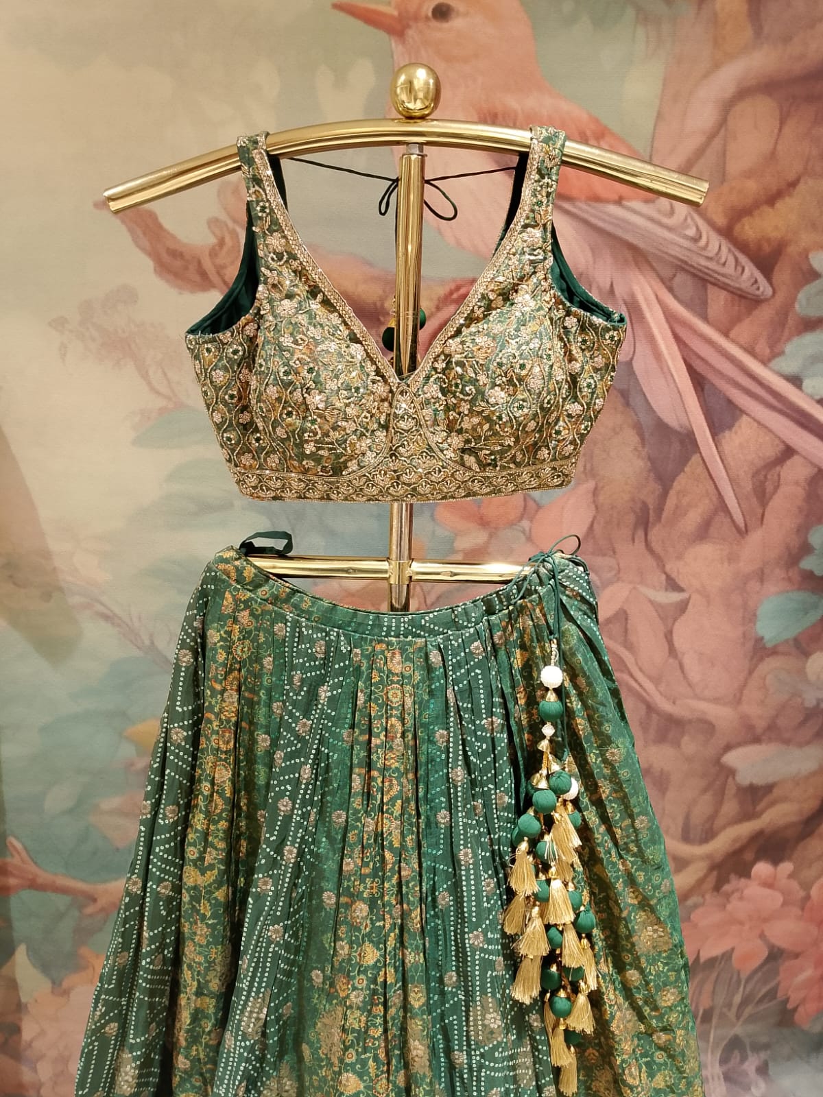 rich emerald-green and rust-red traditional Banarasi Silk lehenga choli printed lehenga skirt, and an ornate Banarasi-style dupatta.
