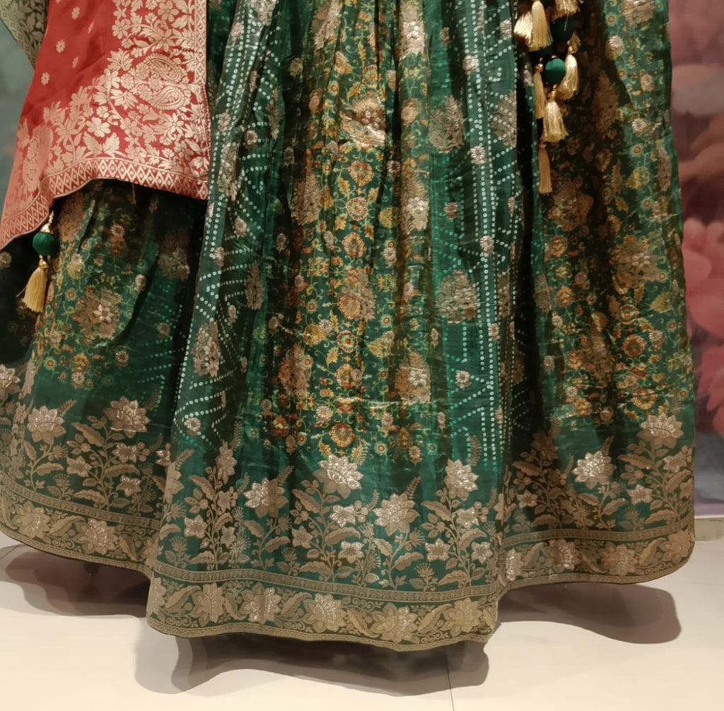 rich emerald-green and rust-red traditional Banarasi Silk lehenga choli printed lehenga skirt, and an ornate Banarasi-style dupatta.