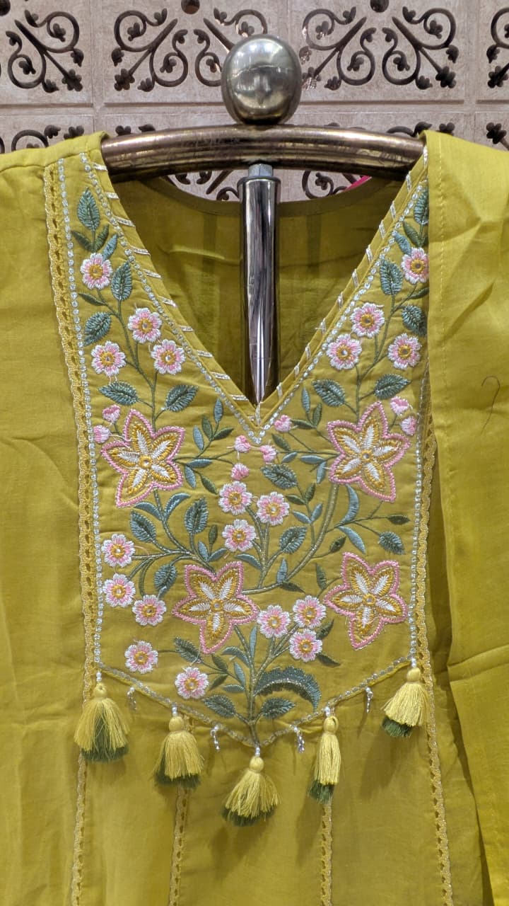 mehendi green Anarkali-style Mul Cotton kurta set.