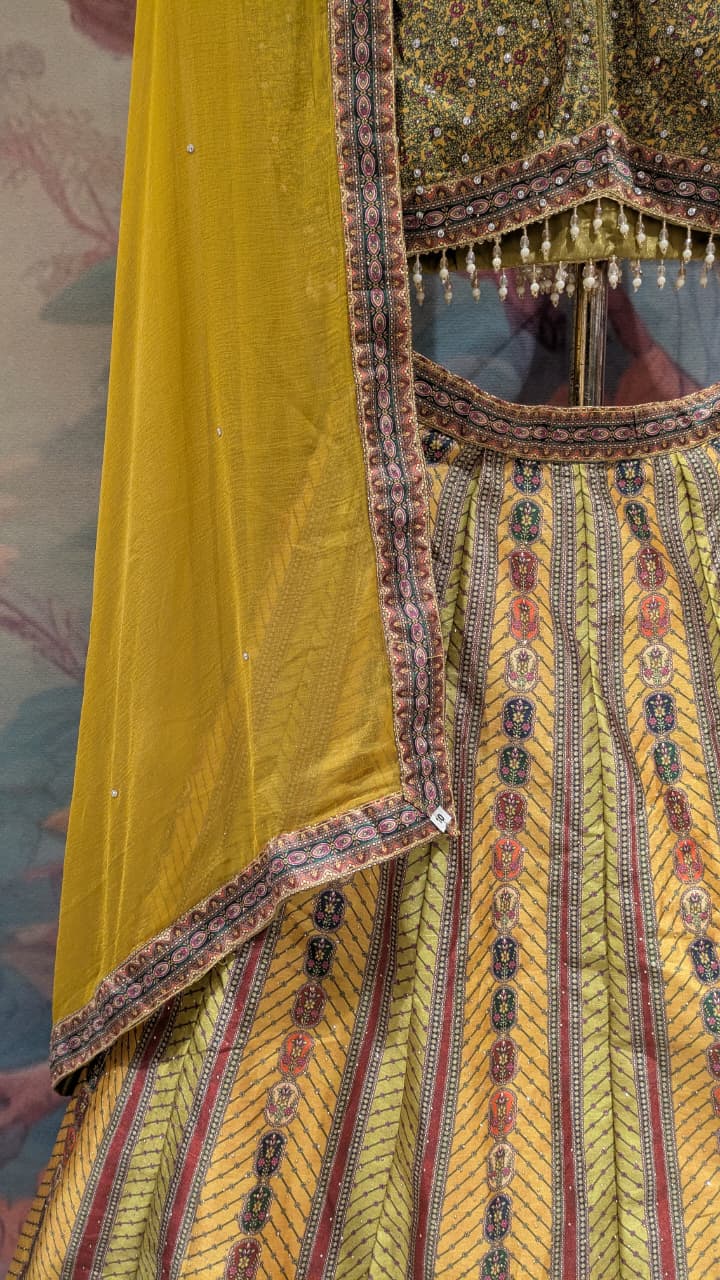Radiant Ochre & Olive Gold Embellished Silk Lehenga Set.