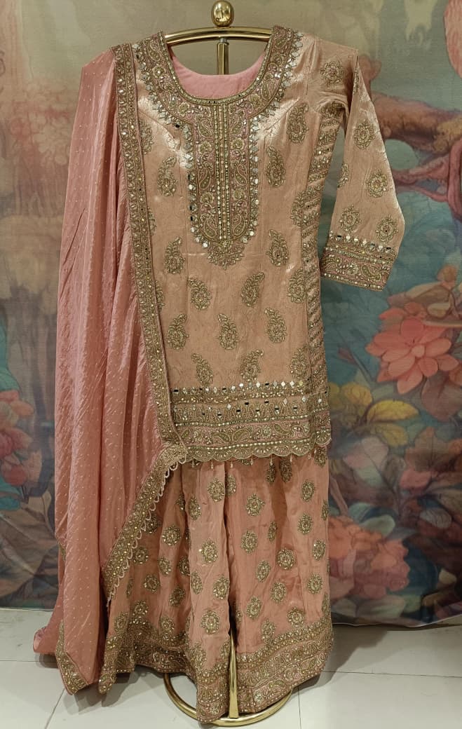 Pastel Peach Heavily Embellished Simmer Silk Short Kurta and Palazzo Ensemble.