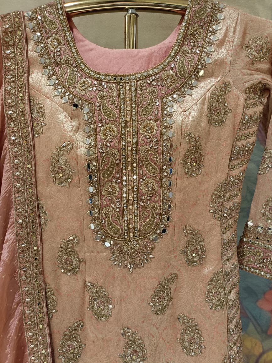 Pastel Peach Heavily Embellished Simmer Silk Short Kurta and Palazzo Ensemble.