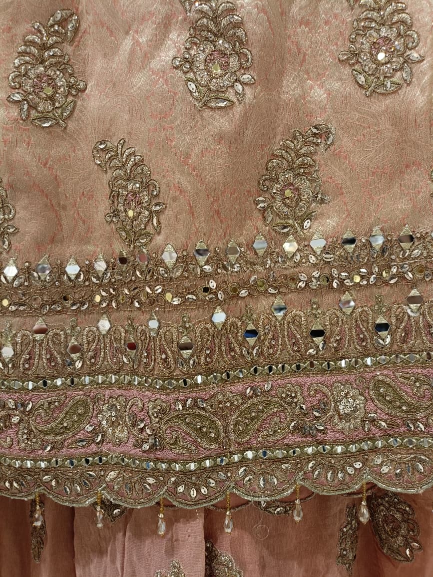 Pastel Peach Heavily Embellished Simmer Silk Short Kurta and Palazzo Ensemble.