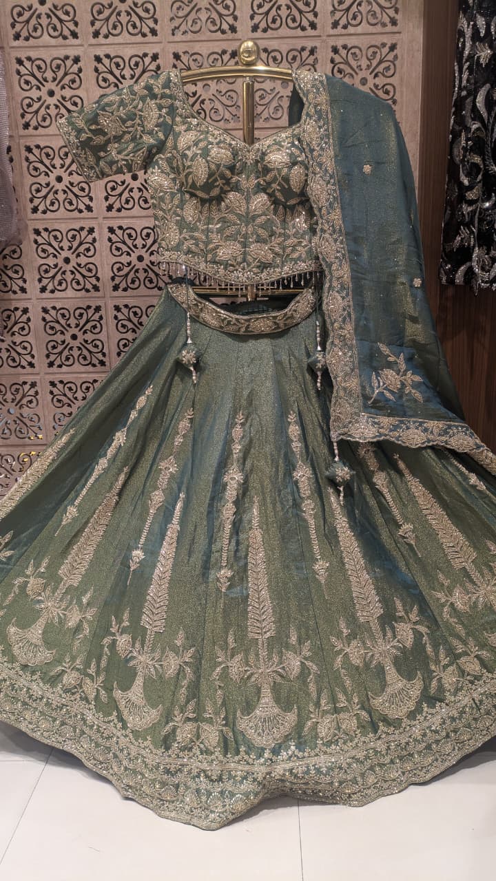 Sage Green & Antique Gold Heavily Embellished Simmer Silk Bridal Lehenga Set.