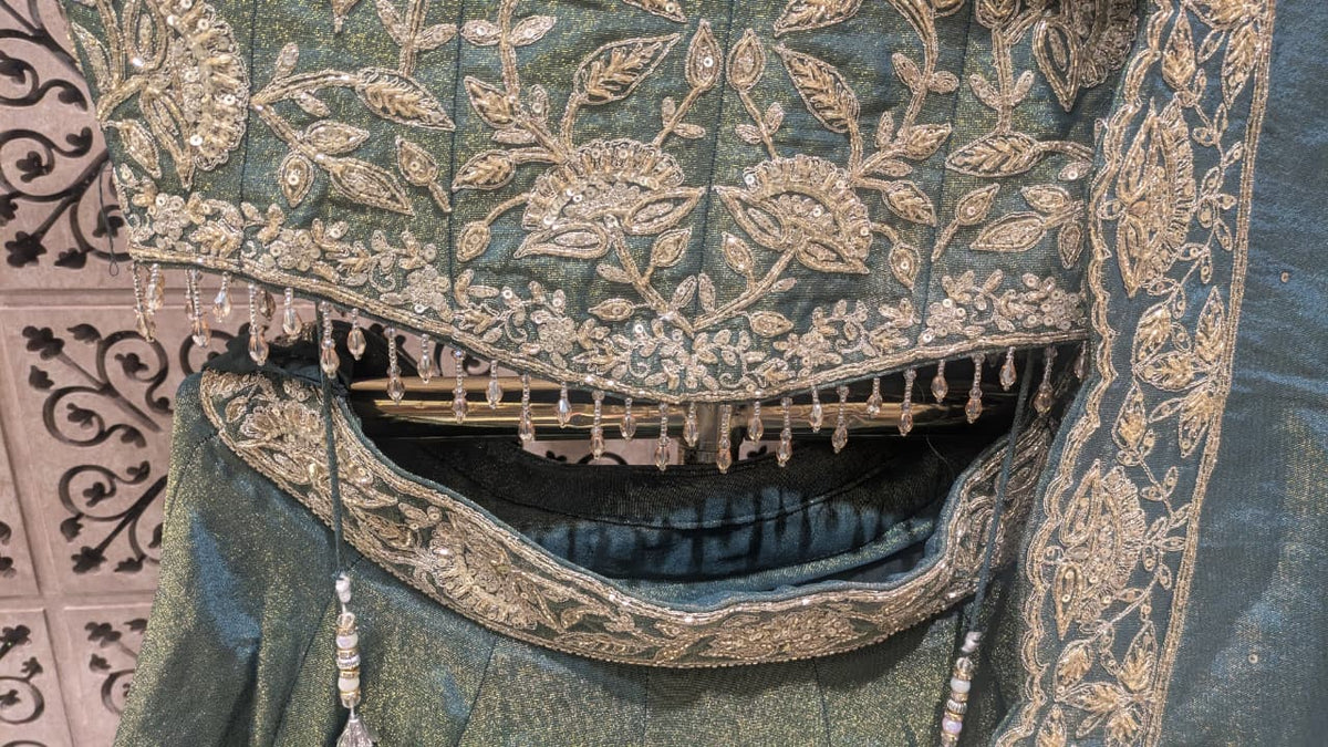 Sage Green & Antique Gold Heavily Embellished Simmer Silk Bridal Lehenga Set.