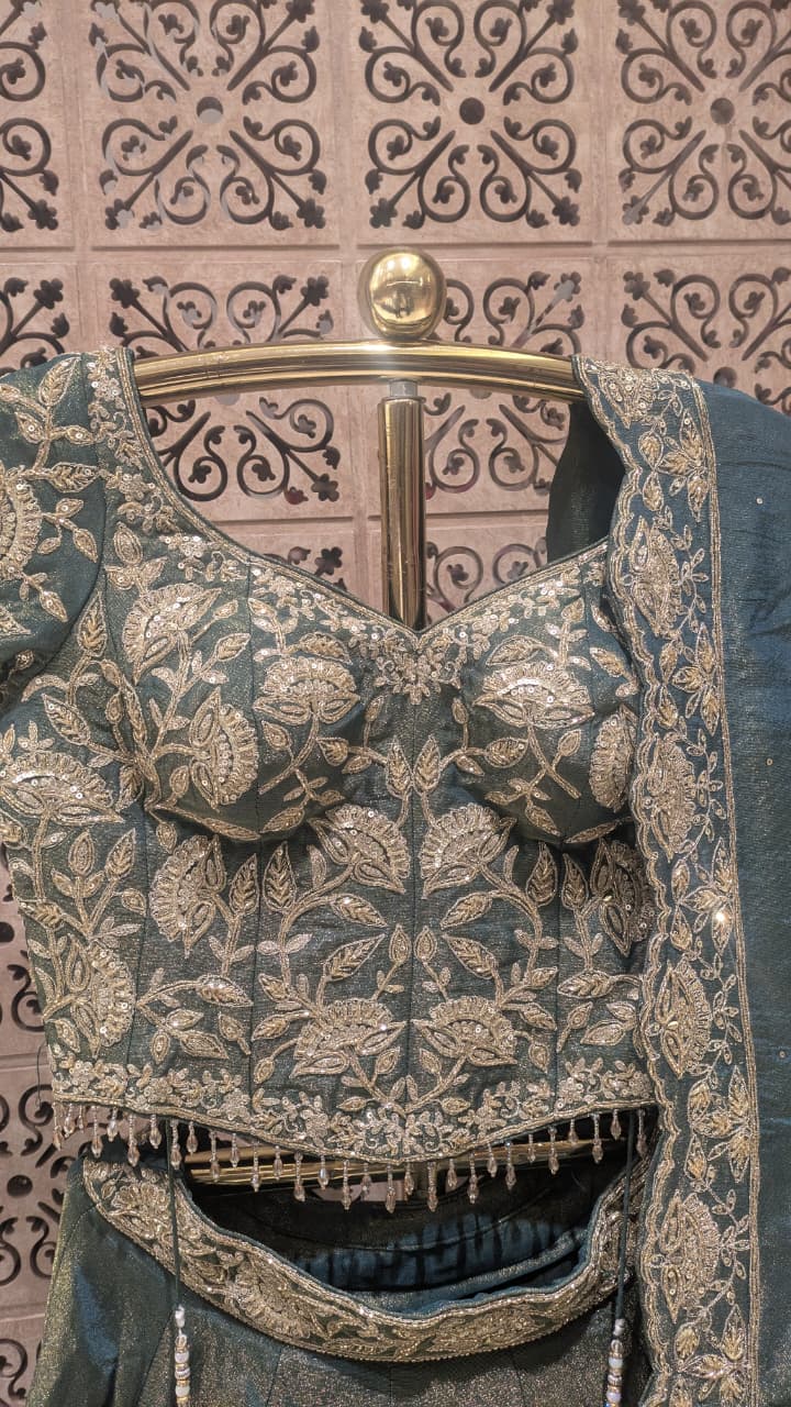 Sage Green & Antique Gold Heavily Embellished Simmer Silk Bridal Lehenga Set.