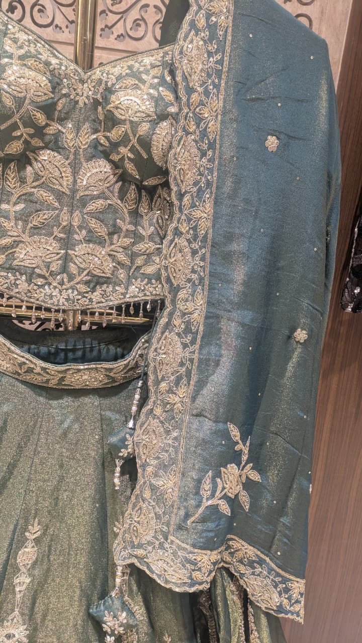 Sage Green & Antique Gold Heavily Embellished Simmer Silk Bridal Lehenga Set.