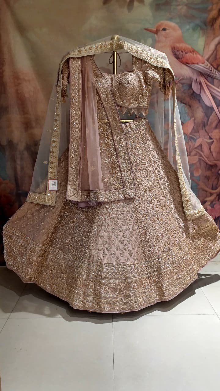 Premium Dusty Rose Pink Simmer Silk Bridal Lehenga with Hand Zardozi Borders.