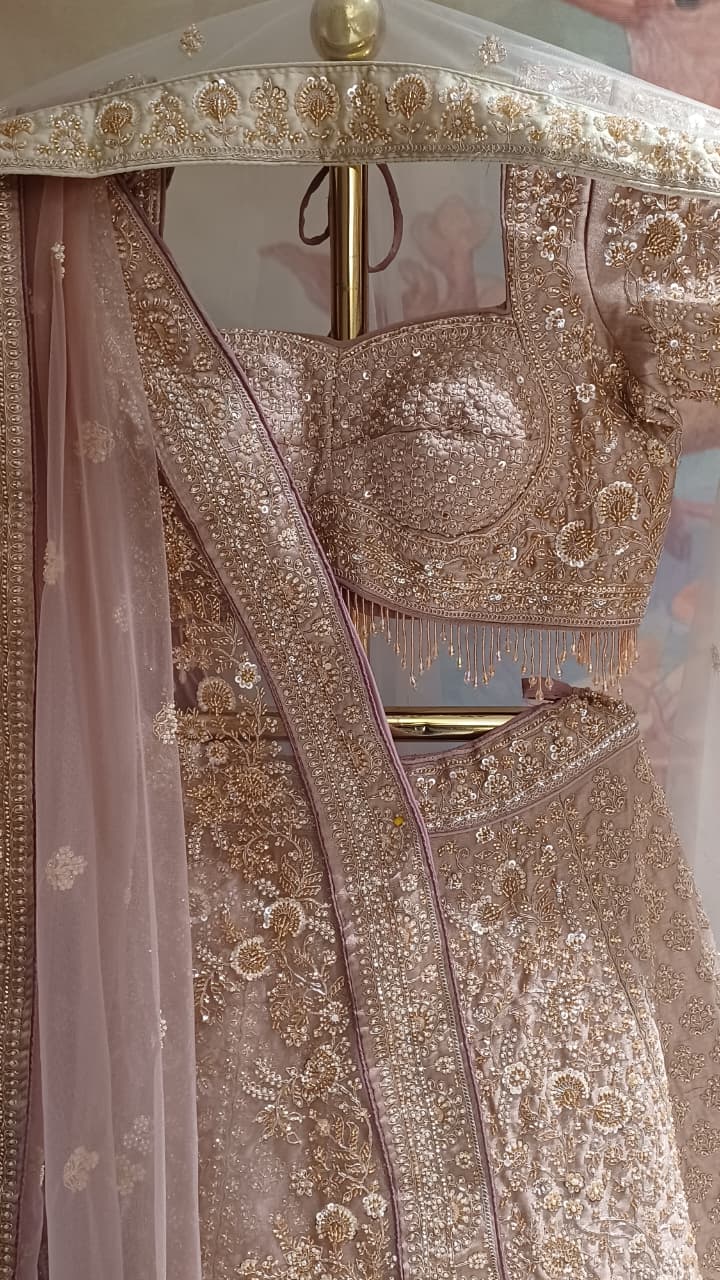 Premium Dusty Rose Pink Simmer Silk Bridal Lehenga with Hand Zardozi Borders.