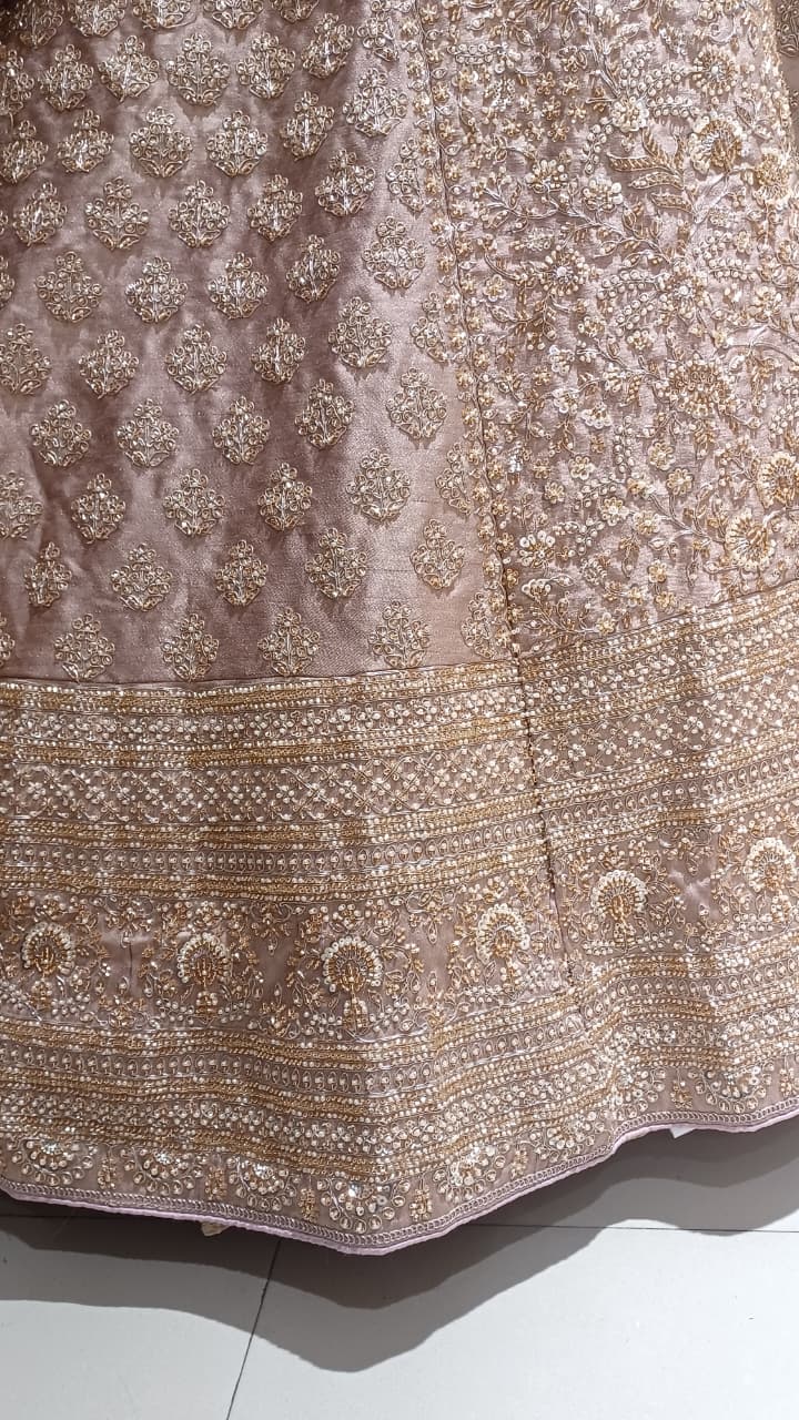 Premium Dusty Rose Pink Simmer Silk Bridal Lehenga with Hand Zardozi Borders.