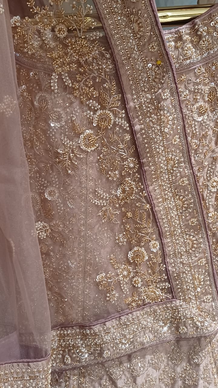 Premium Dusty Rose Pink Simmer Silk Bridal Lehenga with Hand Zardozi Borders.