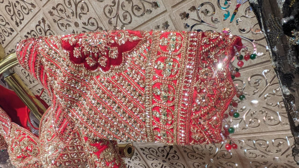 Crimson Red Silk Bridal Lehenga with Heavy Zardozi & Panel Work.
