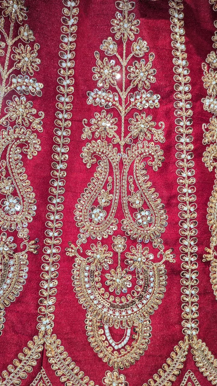 Unstitched Crimson Red Silk Bridal Lehenga with Scalloped Archway Borders.