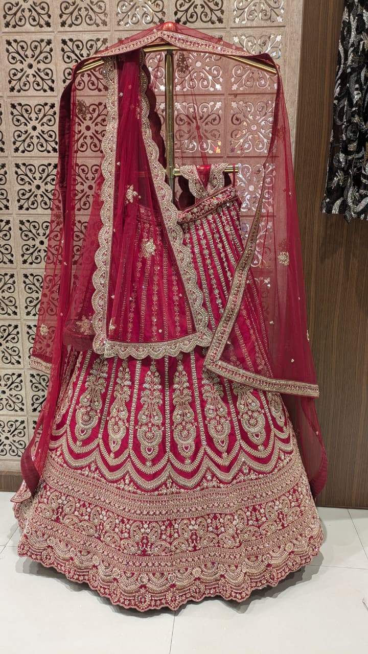 Unstitched Crimson Red Silk Bridal Lehenga with Scalloped Archway Borders.