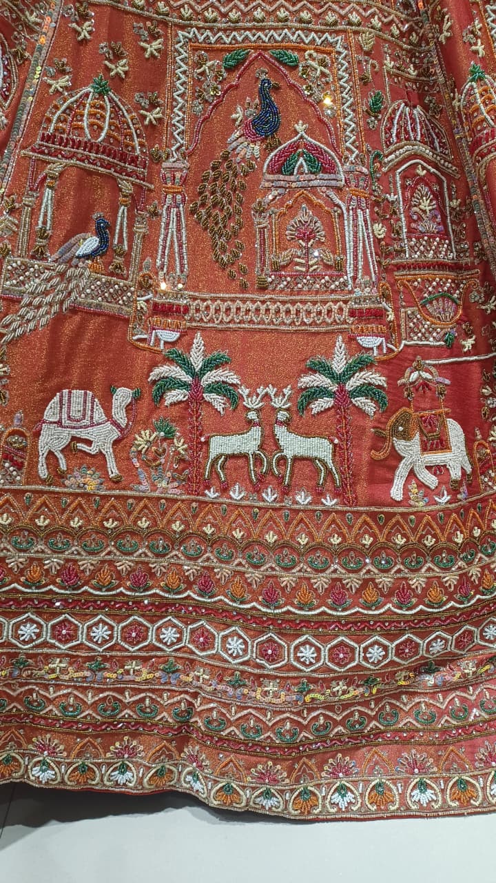 Unstitched Rust-Orange & Crimson Silk Bridal Lehenga with Pichwai Motif Hand Embroidery.