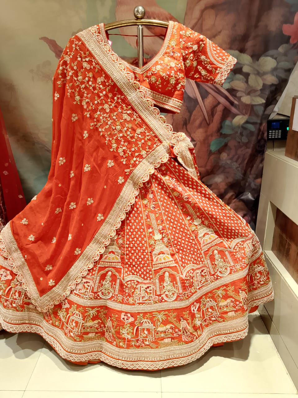 Rust Orange Raw Silk Bridal Lehenga with Heritage Doli and Baraat Zardosi Embroidery.