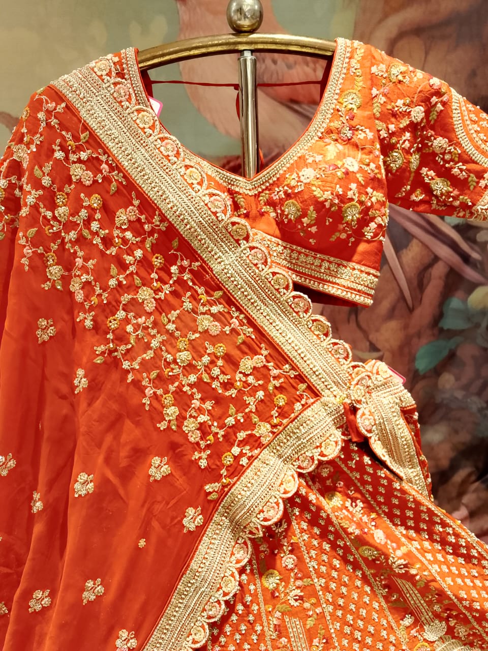 Rust Orange Raw Silk Bridal Lehenga with Heritage Doli and Baraat Zardosi Embroidery.