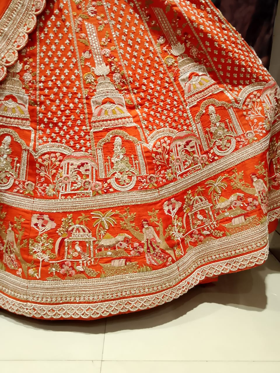 Rust Orange Raw Silk Bridal Lehenga with Heritage Doli and Baraat Zardosi Embroidery.