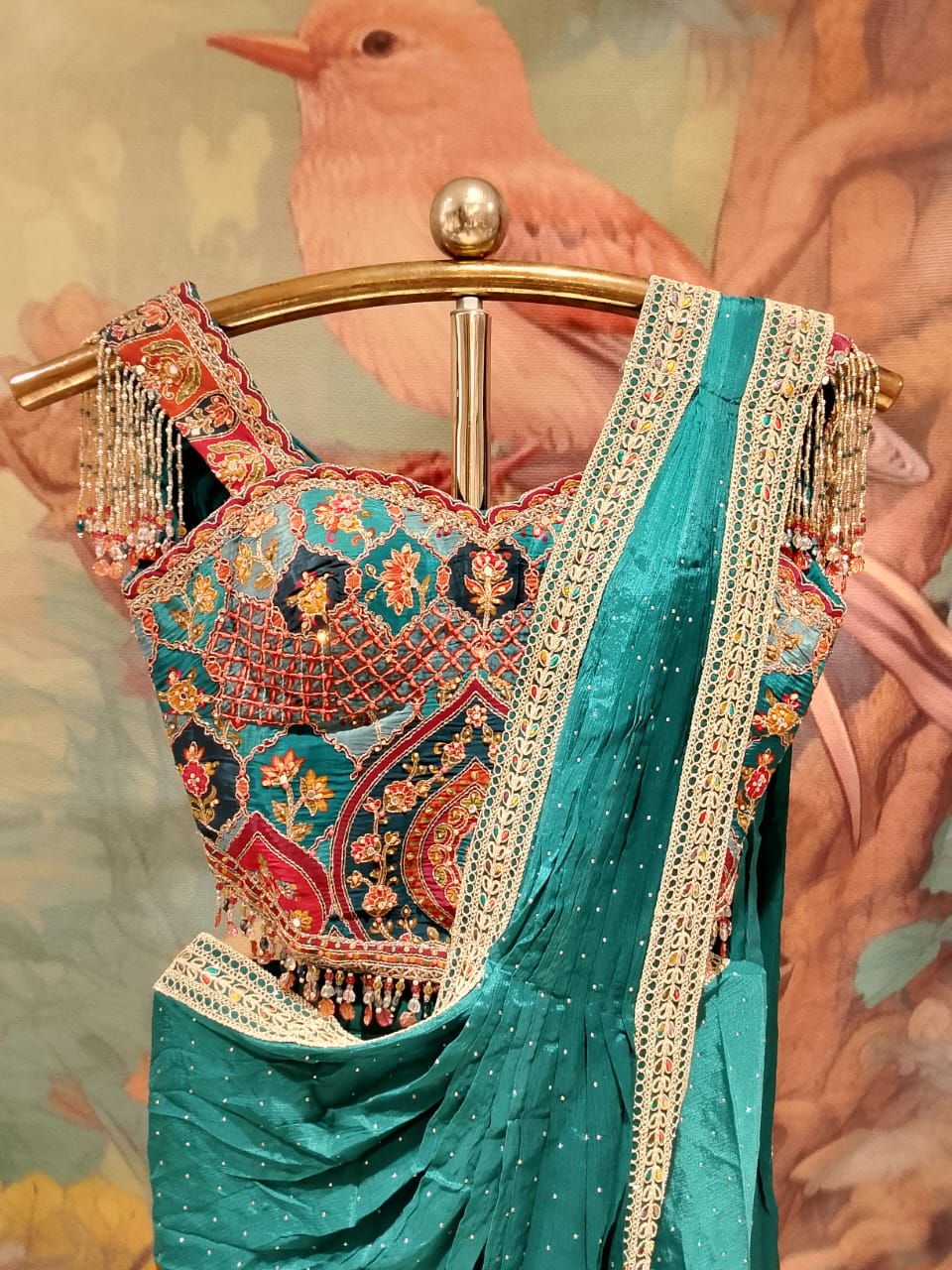 Teal Green Georgette Pre-Stitched Saree with Cold-Shoulder Fringe Blouse.