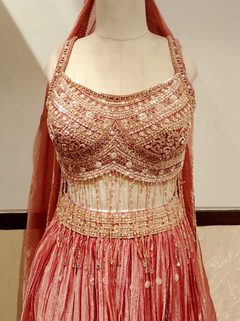 Warm Rose Gold Crush Organza Lehenga Choli Set with Crystal Fringe.