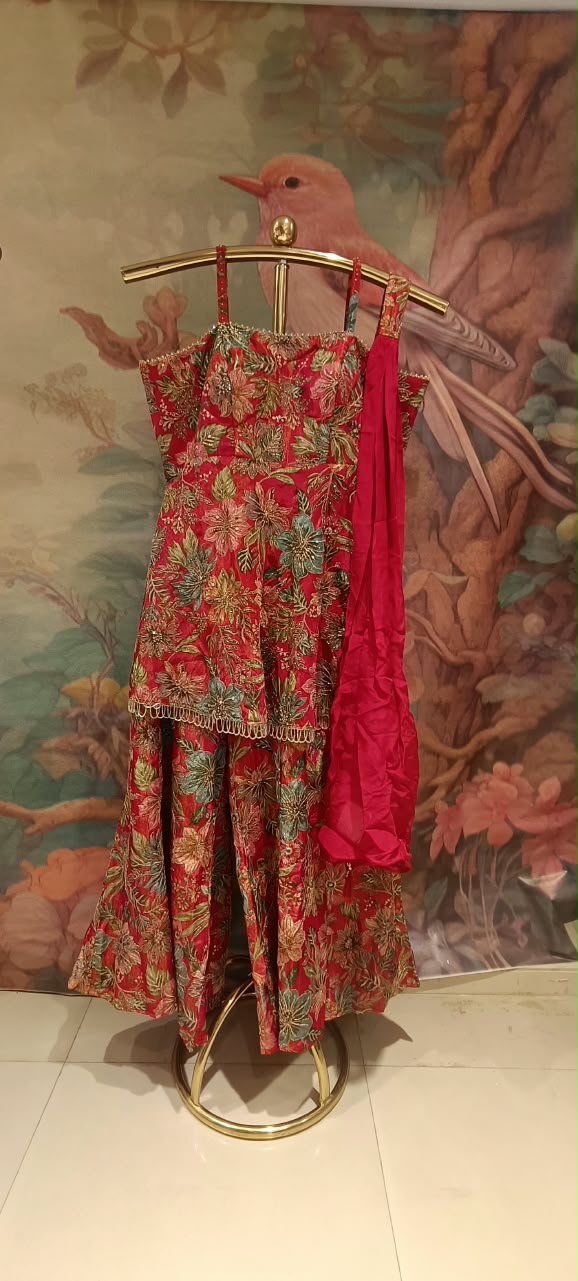 three-piece Palazzo Suit set (rather than a traditional lehenga choli), featuring a long, strappy peplum kurti paired with flared Palazzo pants and a matching dupatta