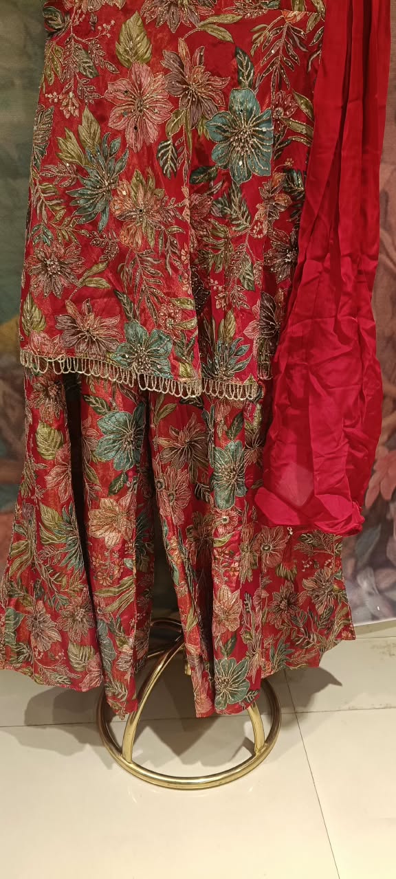 three-piece Palazzo Suit set (rather than a traditional lehenga choli), featuring a long, strappy peplum kurti paired with flared Palazzo pants and a matching dupatta